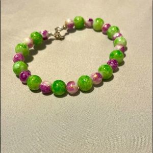 Purple and green wired bracelet with latch